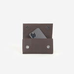 TOTI Phone Holder - Dark Brown — on model, TOTI equestrian accessory
