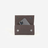 TOTI Phone Holder - Dark Brown — on model, TOTI equestrian accessory